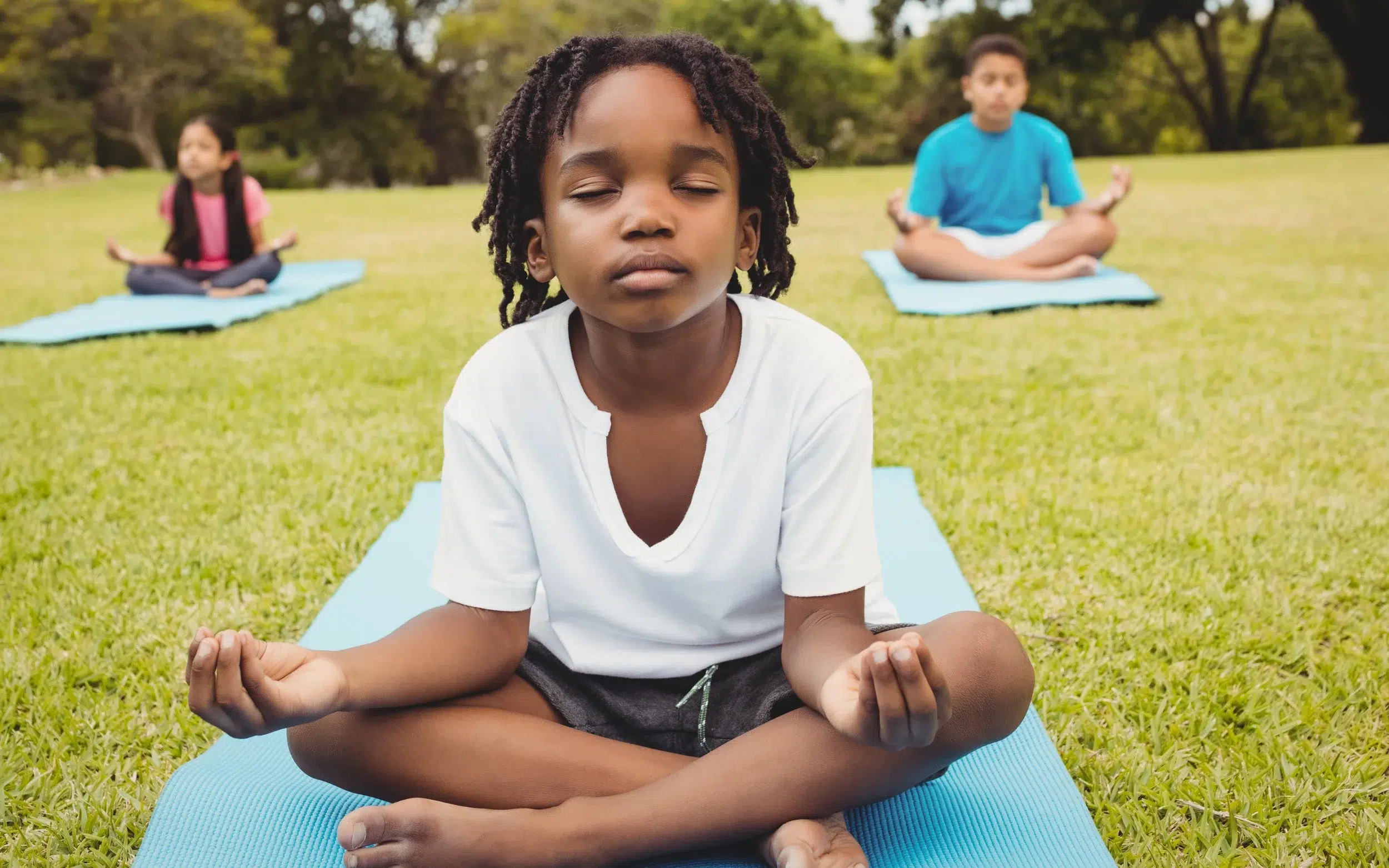 Children sitting in a meditative seat