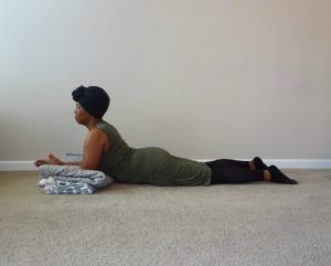 sphinx pose with bolster